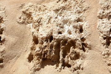 A piece of stone ,the old walls of the fortress in the background 