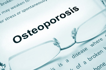 Osteoporosis sign on a paper and glasses.