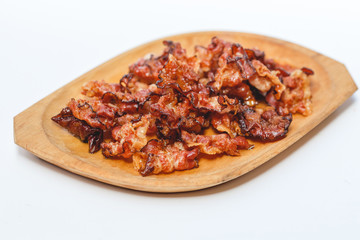 Cooked bacon rashers isolated on white