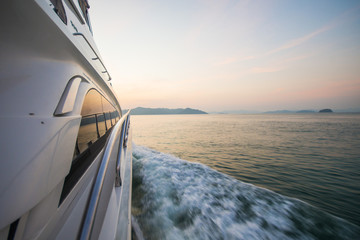 luxury boat yacht on the sea at sunset time - obrazy, fototapety, plakaty