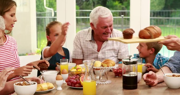 Happy family having breakfast together