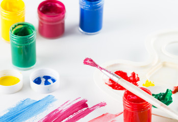 Painting brush with paint and colorful paint on white  background