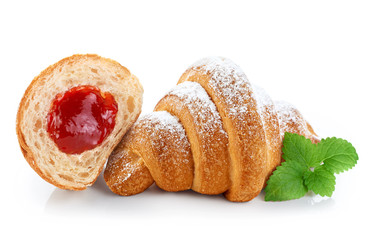 Sliced croissant with jam and sugar powder, isolated on white ba