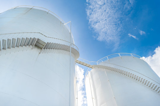 Fuel Tank And Industrial Storage Site On Blue Sky