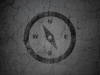 Travel concept: Compass on grunge wall background