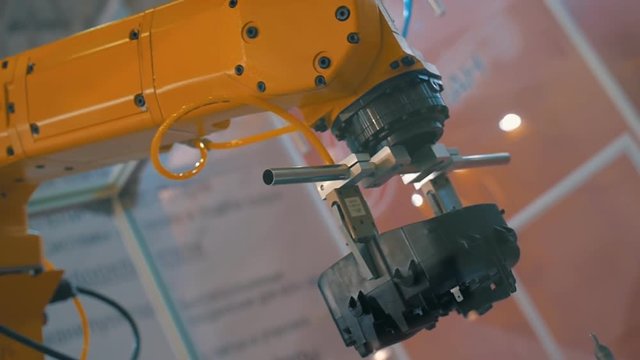 Industrial robot hand performs movements that are programmed in the control unit