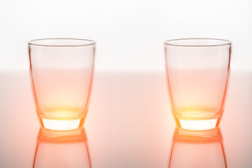 Empty glass for water, juice or milk on white background grey fl