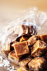 Sweet caramel candies.  Salted caramel pieces and sea salt close