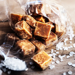 Sweet caramel candies.  Salted caramel pieces and sea salt close