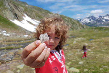Boy shows off mineral crystal found hiking high in the Alps