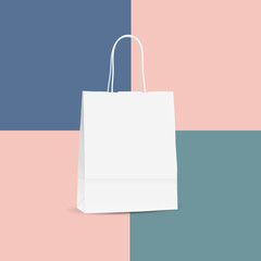 Vector illustration of white shopping paper bag isolated on colo