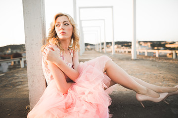 Vintage beautiful fashion girl posing on sunset
