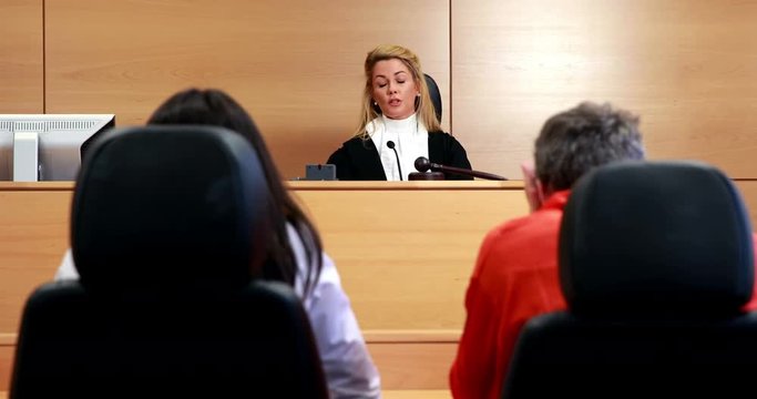 After the trial judge banging gavel on sounding block