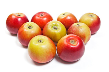 Group of ripe apples on a white background