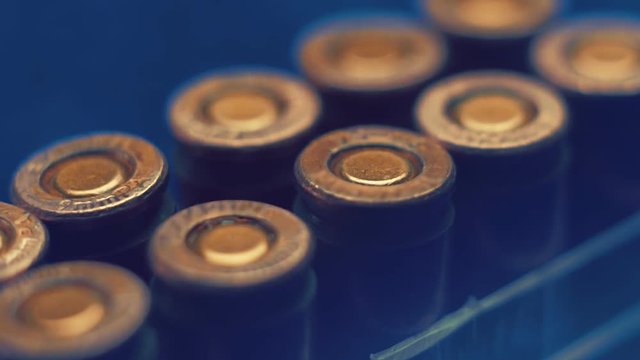 Boxing with the rows of new, not shooting bullet caliber 9mm. Closeup. Color correction