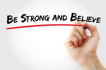 Hand writing Be Strong and Believe with marker, concept background