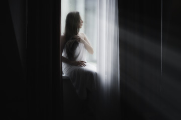 glamor portrait of a girl hotel window