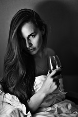 young woman a glass of wine house