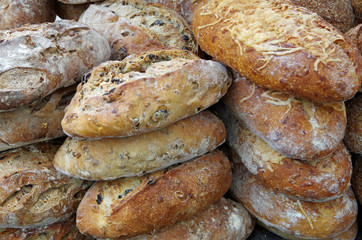 Rustic bread loaves stacked for market