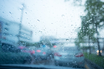 Blurred view of road traffic in rainy day