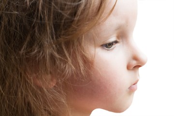 Religion and person . Female profile. Girl's face. On a white background the child. Close up