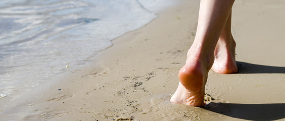 Beach travel - woman walking
