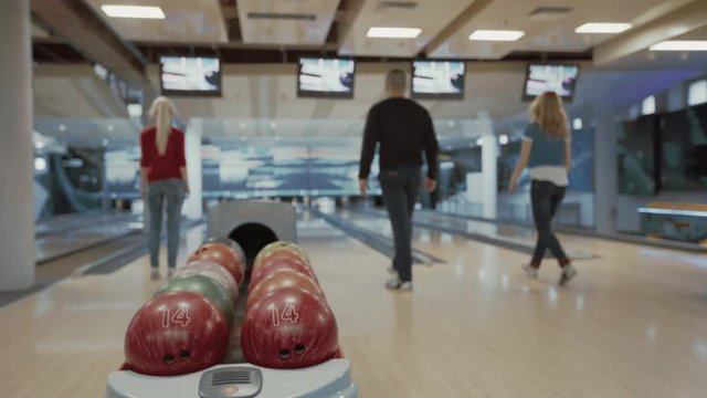 Group of people playing bowling game