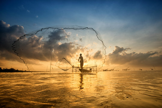 Landscape of Pakpra with fisherman in sunrise at Phatthalung, Th