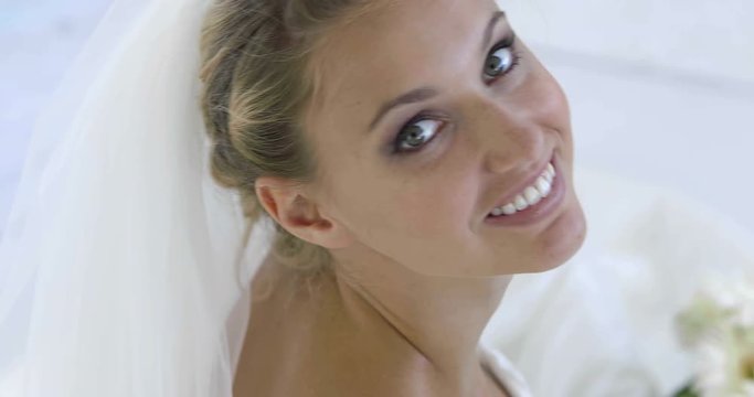 Beautiful bride smiling up at camera