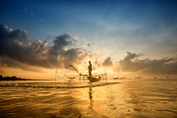 Landscape of Pakpra with fisherman in sunrise at Phatthalung, Th
