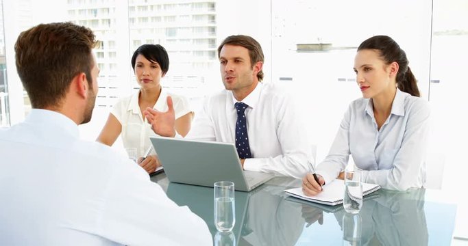 Interview panel explaining to applicant