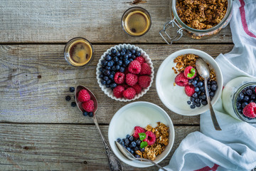 Obraz na płótnie Canvas Breakfast - yogurt with berries and granola