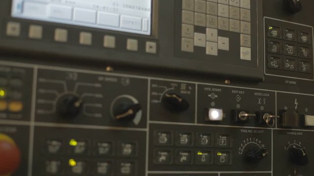 pressing important technology button at control panel in plant