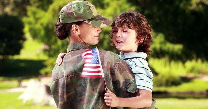 Soldier reunited with her son on a sunny day