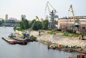 Sand unloaded from the barge for embankment. Photo taken in Kyiv, Ukraine.