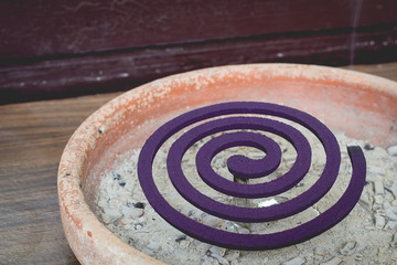 Mosquito coil is mosquito-repelling incense, 
usually shaped into a spiral, and typically 
made from a dried paste of pyrethrum powder.