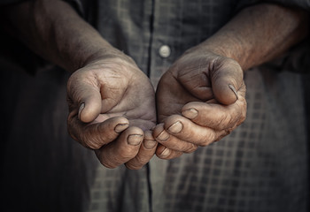 Wrinkled old hands begging asking for money