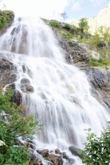 Beautiful waterfall in the Italian mountains Alps