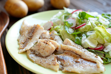 Roasted cod with fresh radish, lettuce and arugula salad