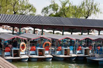 Fototapeta na wymiar Boat near with old China village