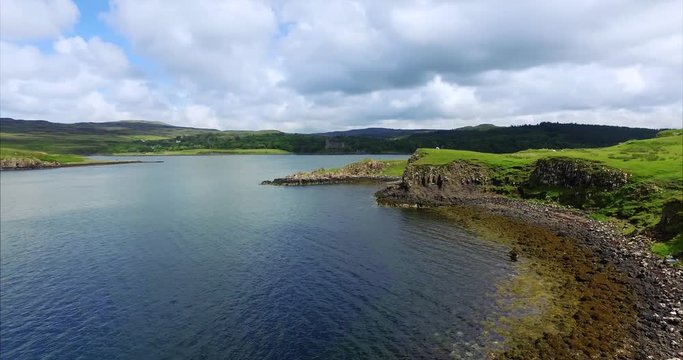 Views of Loch Dunvegan & Dunvegan Castle from Uiginish coastline on the Isle of Skye, Scottish Highlands, UK.