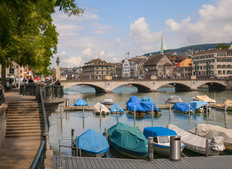 View of moored boats on Limmat river in Zurich, Switzerland