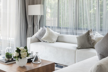 luxury white sofa with pillows set in living room