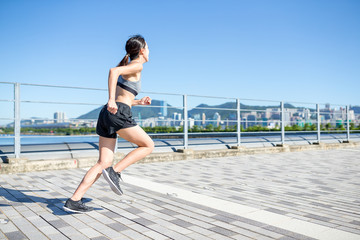 Asian Woman enjoy city running