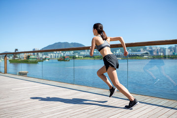 Woman running in a city