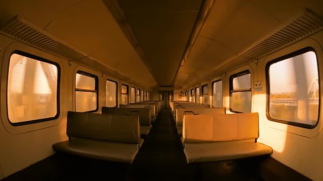 The train passes through the steel railway bridge, view inside the carriage 