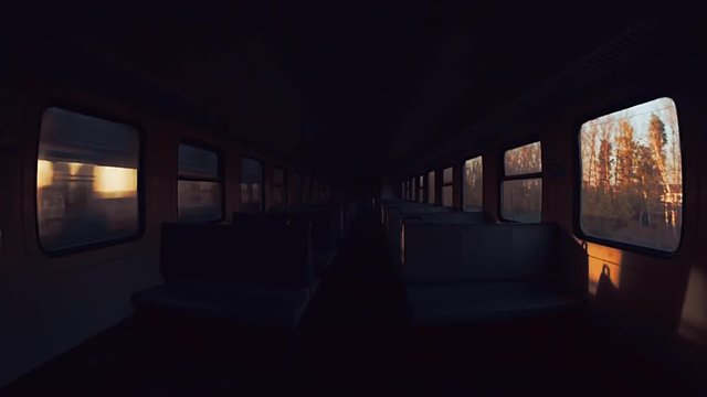 The train is moving to a destination. View inside the empty carriage