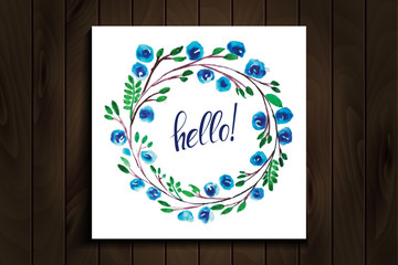 hello lettering in a frame of watercolor flowers