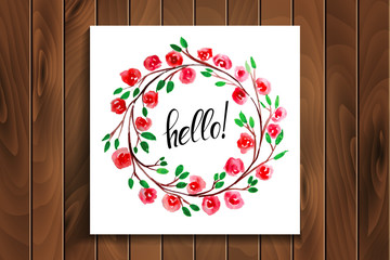 hello lettering in a frame of watercolor flowers