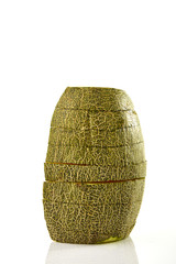 Hamigua Melon cut into slices, Hami Melon, Hami Cantaloupe isolated on white background.